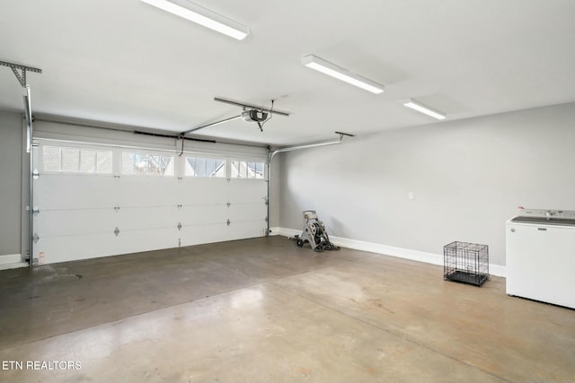 330 Kendall Hunt St, Knoxville, TN 37934 - garage with refrigerator and a garage door opener