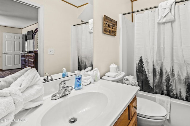 full bathroom featuring vanity, shower / bathtub combination with curtain, and toilet