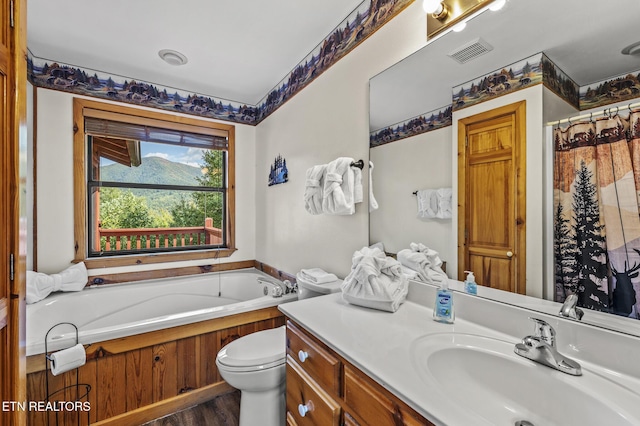 full bathroom featuring plus walk in shower, hardwood / wood-style floors, vanity, and toilet