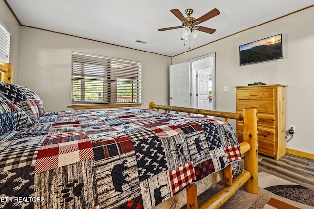 bedroom featuring carpet floors, ceiling fan, and ornamental molding