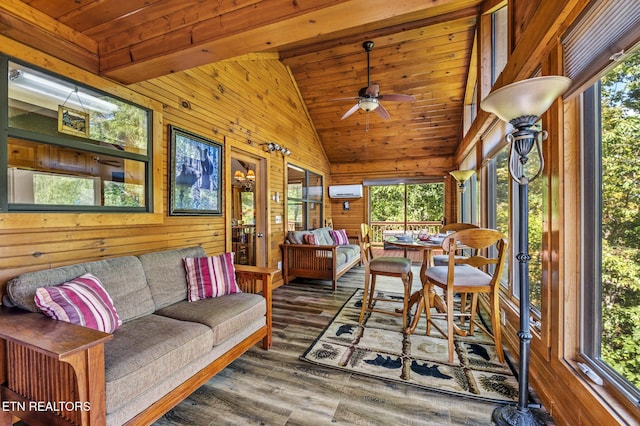 sunroom with vaulted ceiling, ceiling fan, an AC wall unit, and wood ceiling