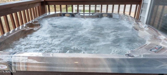 deck with sink and a hot tub