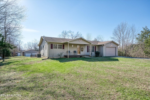 single story home with covered porch, a front lawn, and an outdoor structure