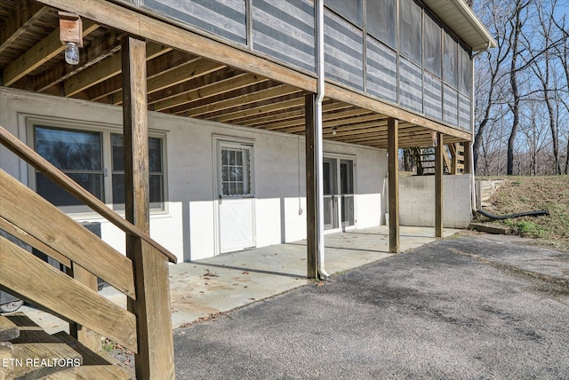 view of property exterior featuring a patio area