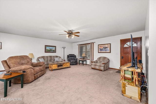 carpeted living room with ceiling fan