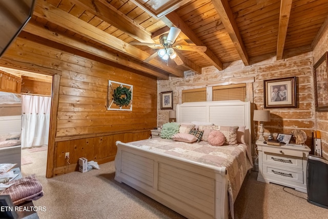 bedroom with wooden walls, ceiling fan, beam ceiling, light colored carpet, and wood ceiling