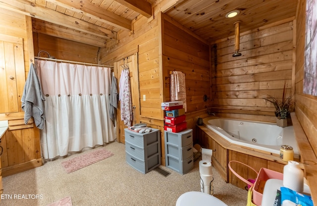 bathroom featuring beamed ceiling, a bathing tub, wooden ceiling, and wooden walls