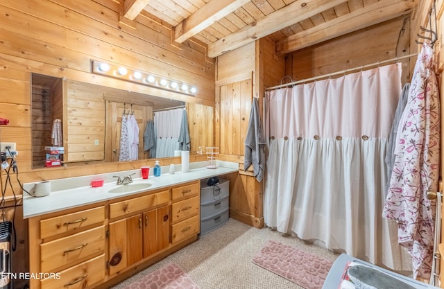 bathroom with wood walls, vanity, beam ceiling, and wooden ceiling