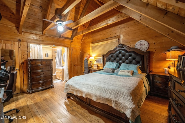 bedroom with lofted ceiling with beams, light hardwood / wood-style flooring, ceiling fan, and wooden ceiling