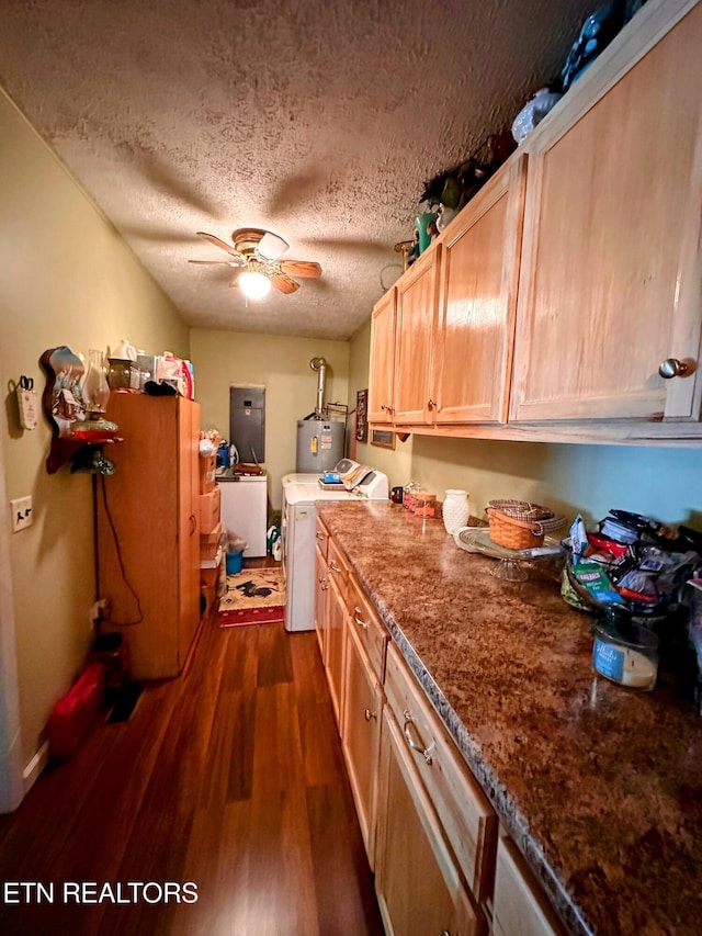 kitchen with gas water heater, dark hardwood / wood-style floors, a textured ceiling, light brown cabinetry, and washer / clothes dryer