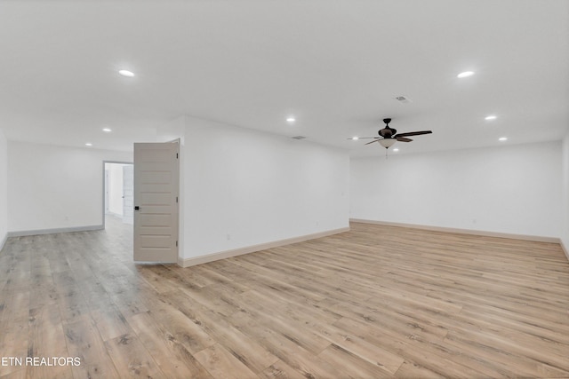 spare room with ceiling fan and light hardwood / wood-style flooring