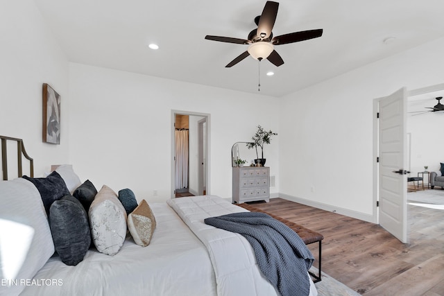 bedroom featuring ceiling fan and light hardwood / wood-style floors