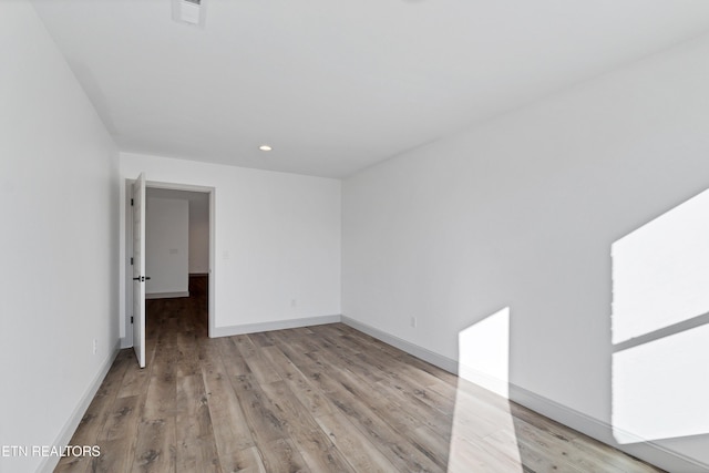 spare room with light wood-type flooring