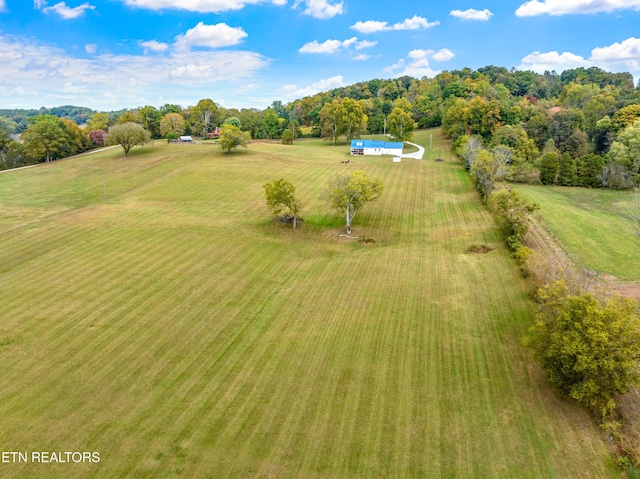 birds eye view of property featuring a rural view