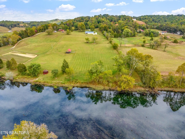 birds eye view of property with a water view and a rural view