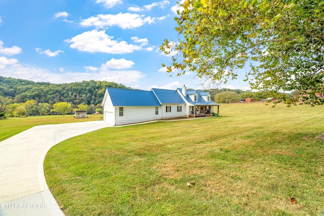 view of front of property with a porch and a front lawn