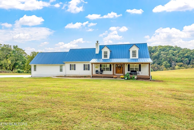 view of front facade with covered porch and a front yard