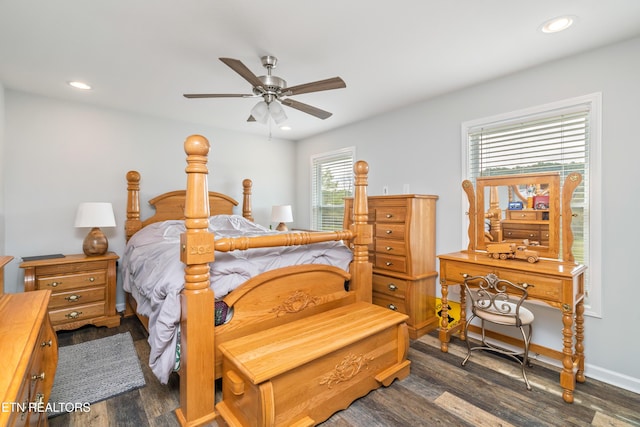 bedroom with ceiling fan and dark wood-type flooring