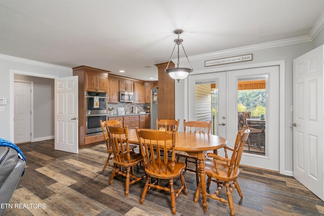 dining area with french doors, dark wood-type flooring, and ornamental molding