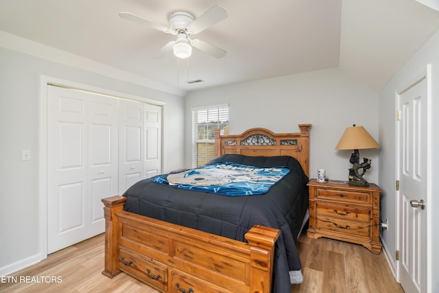 bedroom featuring ceiling fan, light wood-type flooring, and a closet