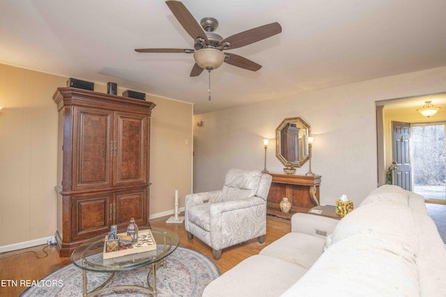 living room with light wood-type flooring and ceiling fan