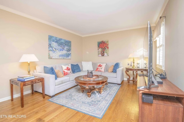 living room featuring crown molding and hardwood / wood-style flooring