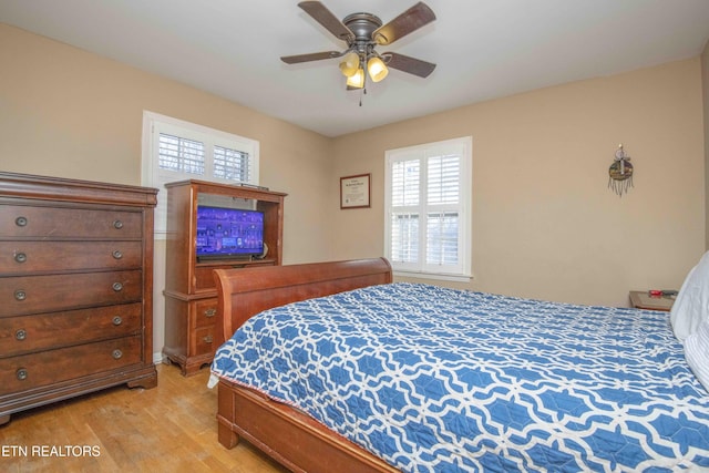 bedroom featuring ceiling fan and light hardwood / wood-style flooring