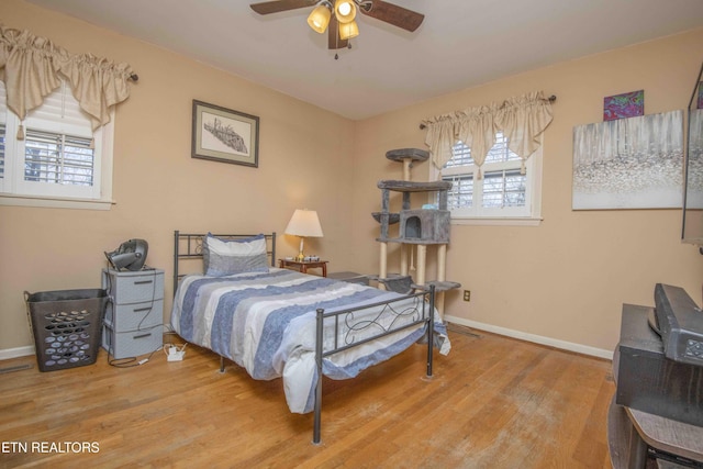 bedroom featuring ceiling fan and wood-type flooring