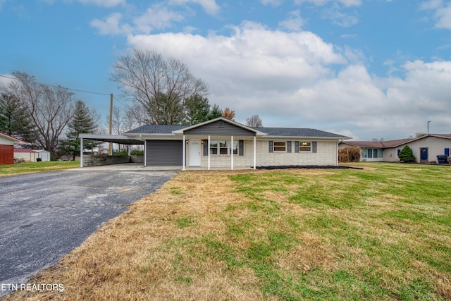 single story home with a front lawn, covered porch, and a carport