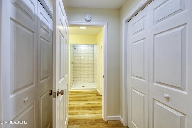 hall with light hardwood / wood-style floors