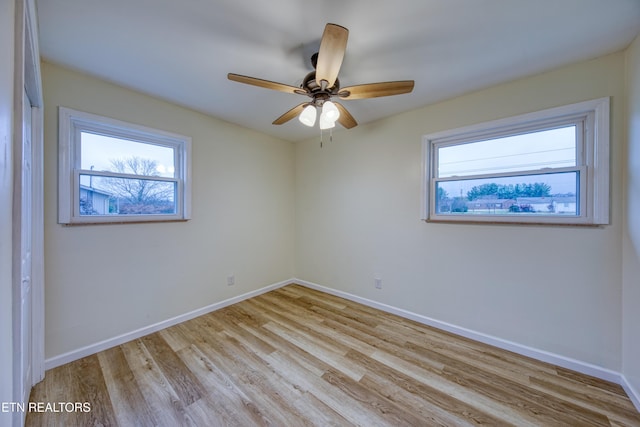 unfurnished room featuring light hardwood / wood-style floors and ceiling fan