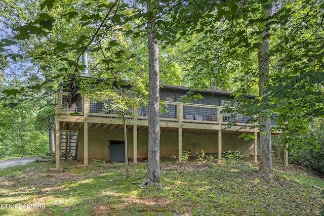 back of house featuring a deck