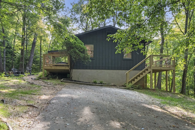 view of side of property featuring a deck