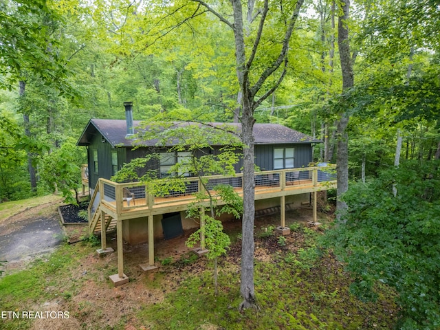 back of property featuring a wooden deck