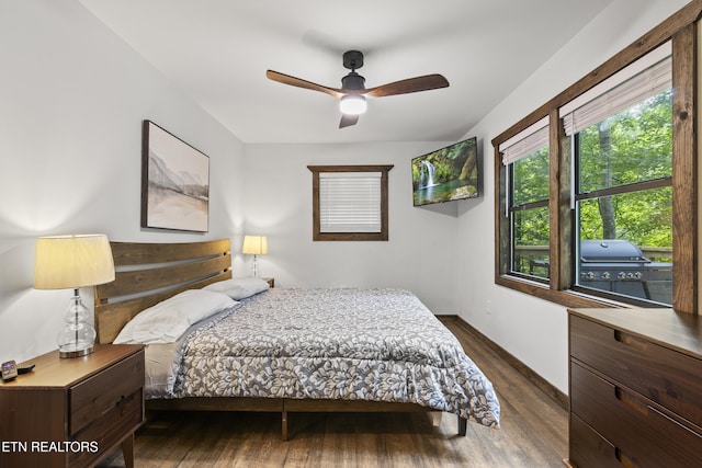 bedroom featuring ceiling fan and dark hardwood / wood-style floors