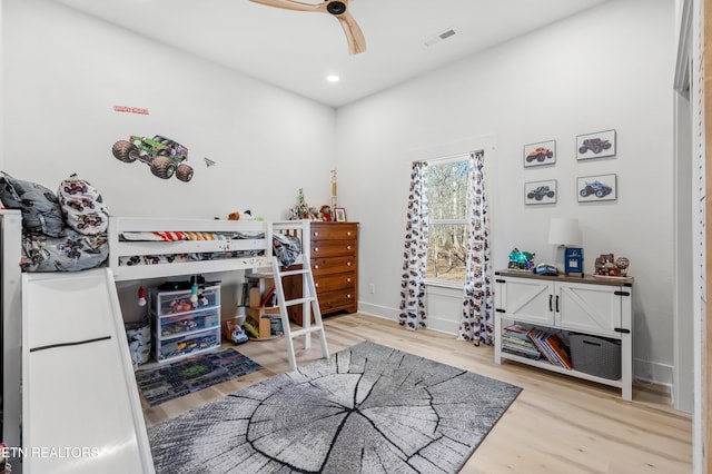 bedroom featuring light wood-type flooring and ceiling fan