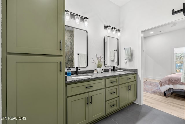 bathroom with tile patterned flooring and vanity