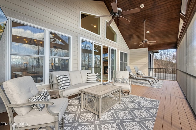 deck with outdoor lounge area and ceiling fan