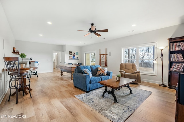 living room with ceiling fan, light wood-type flooring, and billiards