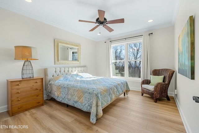 bedroom featuring ceiling fan, light hardwood / wood-style flooring, and crown molding