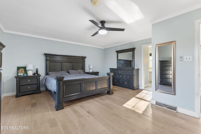 bedroom featuring connected bathroom, ceiling fan, light wood-type flooring, and ornamental molding