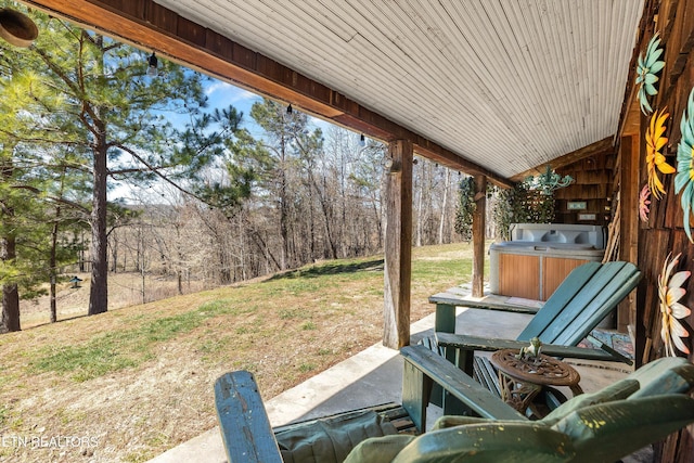 view of patio / terrace with a hot tub