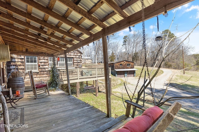 wooden deck featuring an outdoor structure