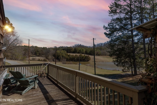 wooden deck with a water view