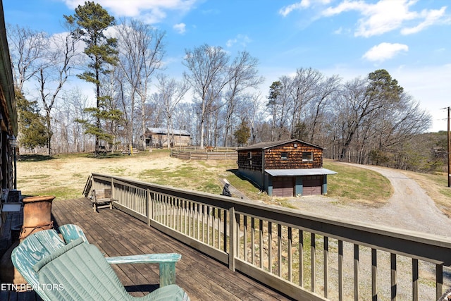 deck featuring a yard and an outdoor structure