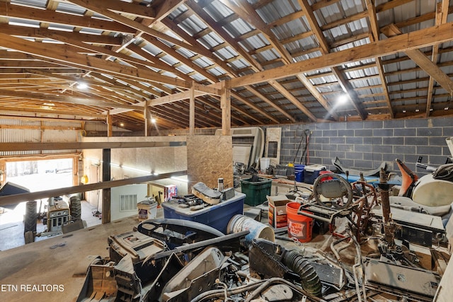 garage featuring visible vents and concrete block wall