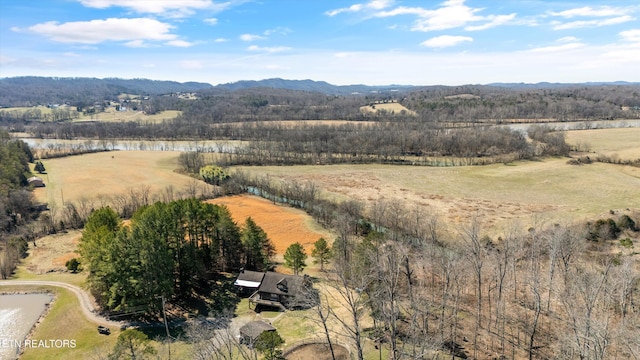 bird's eye view with a wooded view, a water and mountain view, and a rural view