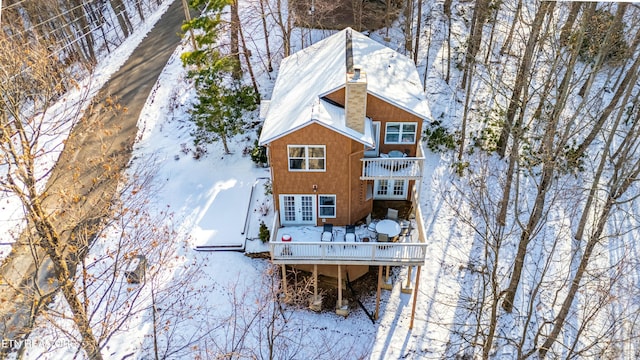 view of snow covered house