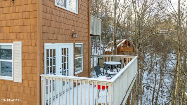 view of snow covered deck