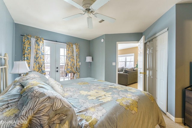 carpeted bedroom featuring ceiling fan, access to exterior, multiple windows, and a closet